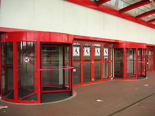 Image showing Red revolving doors