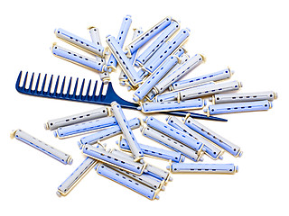 Image showing Handle rake and hair rollers