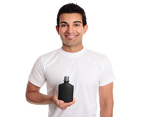 Image showing Man holding black bottle or product