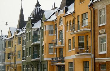 Image showing Colorful houses in snowfall 