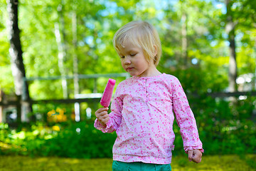 Image showing Little girl with ice-cream