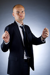 Image showing businessman holding an imaginary sign