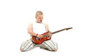 Image showing man playing a guitar 