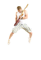 Image showing passionate guitarist jumps