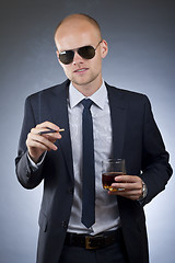 Image showing smoking businessman