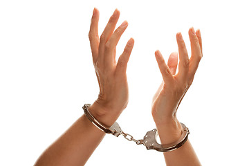 Image showing Handcuffed Woman Raising Hands in Air on White