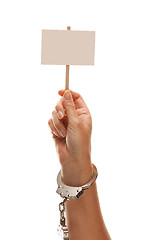 Image showing Handcuffed Woman Holding Blank White Sign Isolated on White
