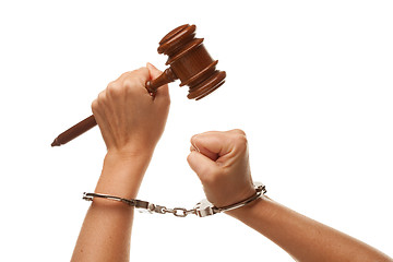 Image showing Handcuffed Woman Holding Wooden Gavel on White