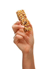 Image showing Woman Holding Granola Bar on White