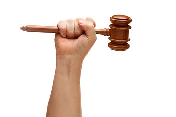 Image showing Man Holding Wooden Gavel in Fist on White