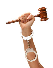 Image showing Handcuffed Woman Holding Wooden Gavel on White