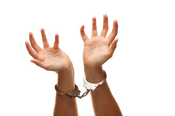 Image showing Handcuffed Woman Raising Hands in Air on White