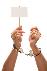 Image showing Handcuffed Woman Holding Blank White Sign Isolated on White