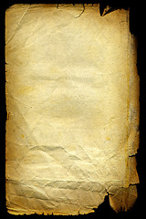 Image showing Old textured paper with tattered edge. On black