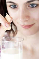 Image showing Young people eating milk with cereals