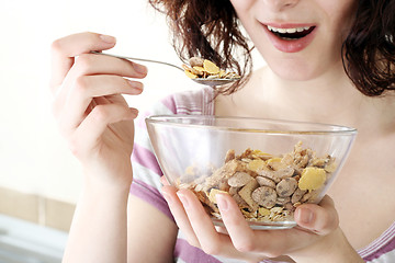 Image showing Young people eating milk with cereals