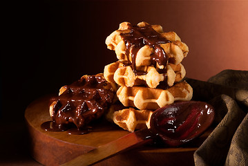 Image showing chocolate syrup and Belgian waffles