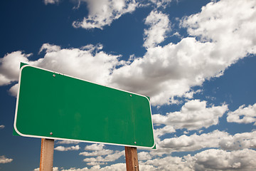 Image showing Blank Green Road Sign Over Clouds with Text Room