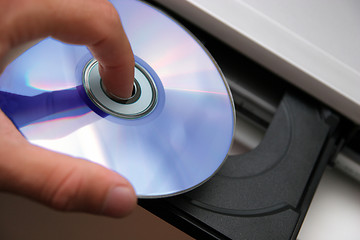 Image showing insert CD on CD player