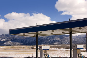 Image showing Gas Station and Cloudy Skies