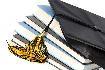 Image showing graduation cap and books