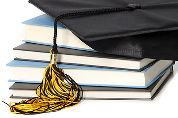 Image showing graduation cap and books