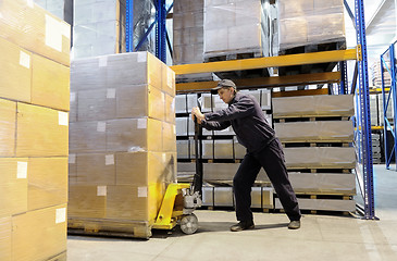 Image showing worker at warehouse with loader