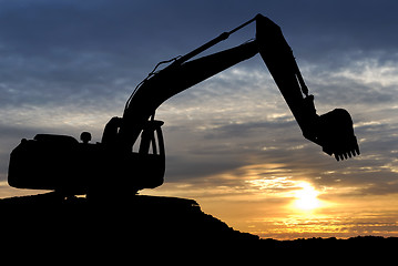 Image showing Loader excavator over sunset