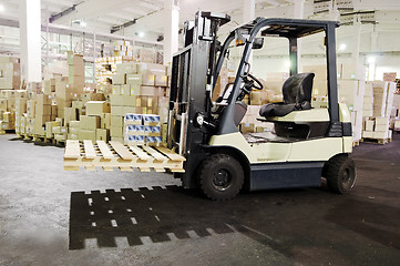 Image showing Forklift stacker in warehouse