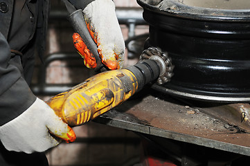 Image showing cleaning a car wheel disc 