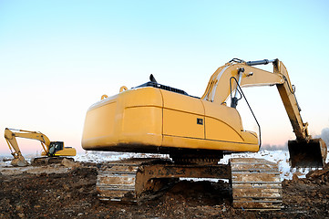 Image showing two loader excavators in open cast in winter