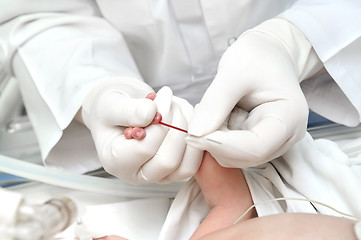 Image showing newly-born child blood sampling