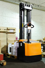 Image showing warehouse forklift stacker with boxes