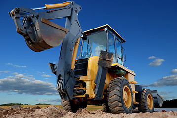 Image showing rear view of  Loader excavator with rised backhoe