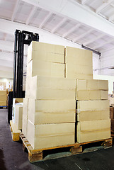 Image showing warehouse forklift stacker with boxes