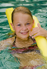 Image showing blonde girl with a styrofoam noodle