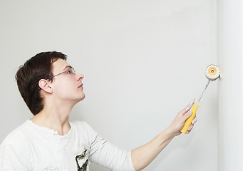 Image showing Painter worker decorator with roller