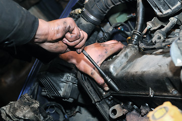 Image showing mechanic repairman at car repair work