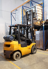 Image showing forklift loader stacking in warehouse