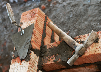 Image showing bricklayer equipment trowel and hack