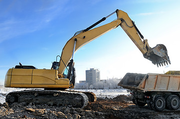 Image showing loader excavator loading a rear-end tipper