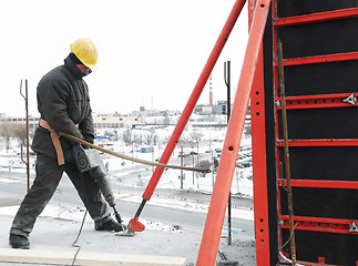 Image showing worker builder and concrete formwork