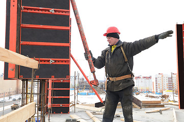 Image showing worker builder and concrete formwork