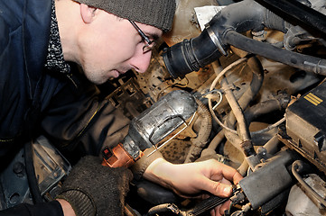 Image showing mechanic repairman at car repair work