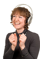 Image showing cheerful smiling girl with headphones isolated