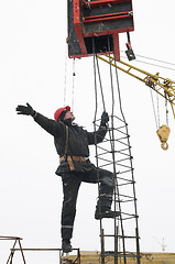 Image showing worker builder installing a concrete formwork