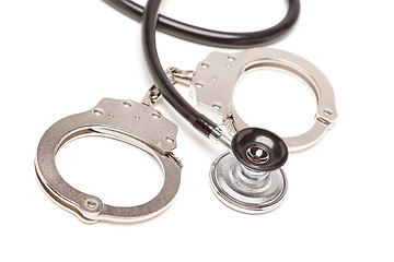 Image showing Stethoscope and Handcuffs on White