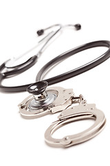 Image showing Stethoscope and Handcuffs on White