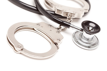 Image showing Stethoscope and Handcuffs on White