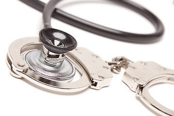 Image showing Stethoscope and Handcuffs on White